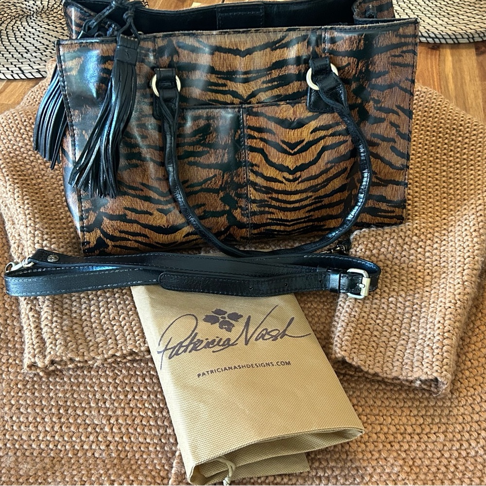 Measures: 13"L x 5-1/2"W x 9-"H; 7-1/4" handle drop, 23" strap drop.